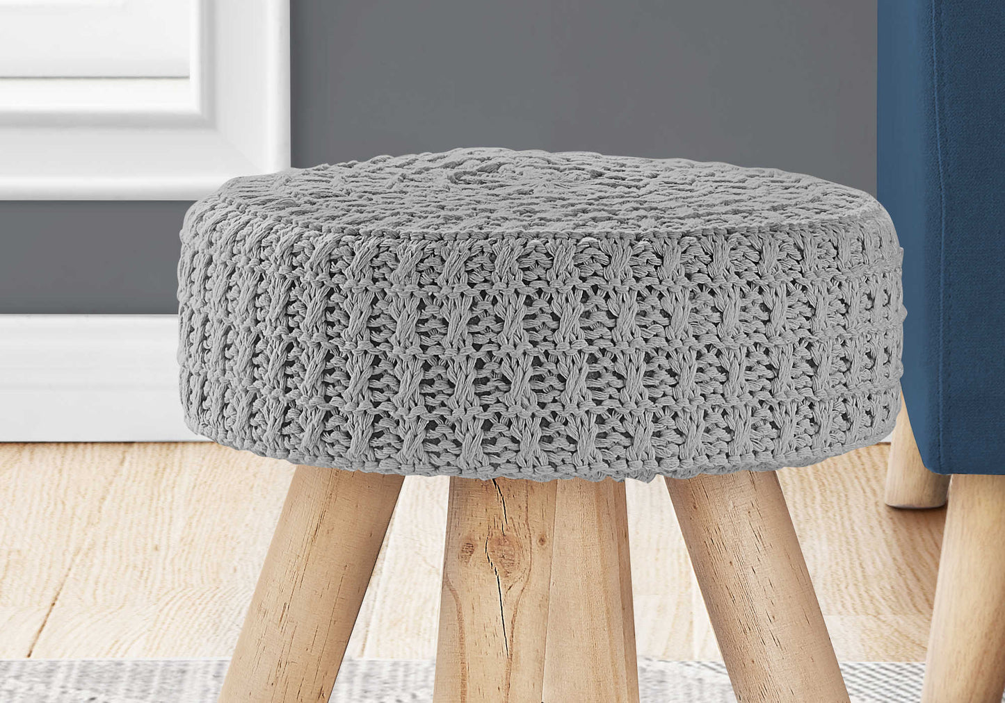 Close up of GREY KNIT OTTOMAN / NATURAL WOOD LEGS