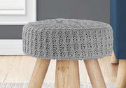 Close up of GREY KNIT OTTOMAN / NATURAL WOOD LEGS