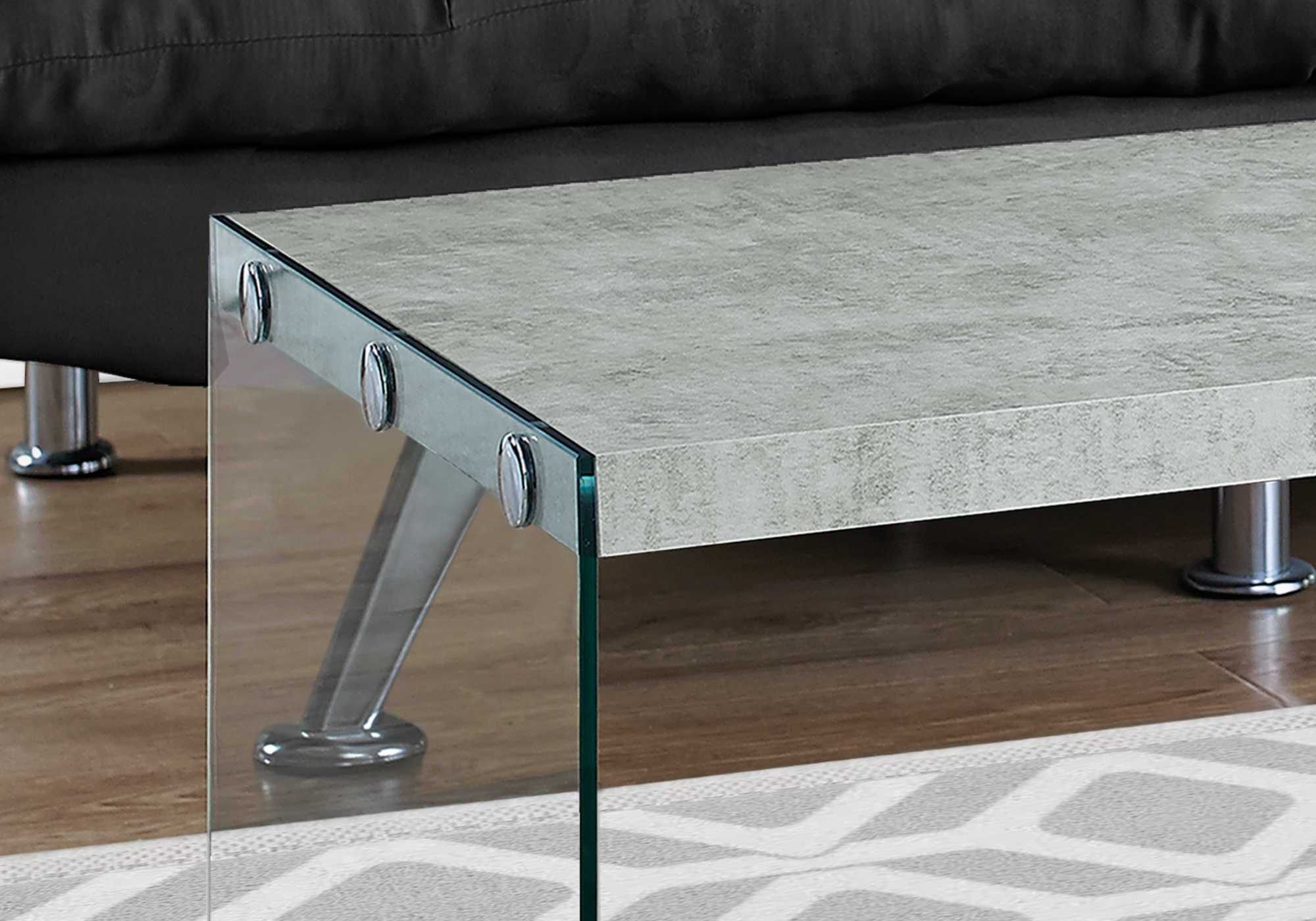 close up grey cement coffee table tempered glass legs