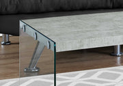 close up grey cement coffee table tempered glass legs